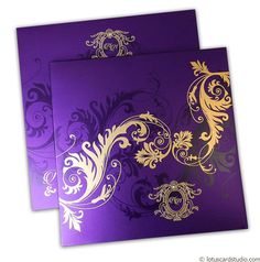 two purple and gold wedding cards