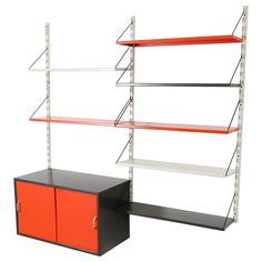 two shelving units with red and black shelves