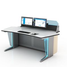 an office desk with two computers on it