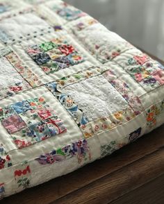 a close up of a quilt on a table