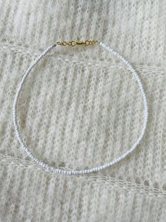 This basic white seed bead necklace is perfect for all year round and matches with every outfit! Please message us with any questions! Open to customizing! Tiny Seed Bead Jewelry, Cute White Beaded Necklace With Tiny Beads, White Seed Bead Bracelets, White Tiny Beads Bracelet, White Seed Bead Necklace, Cute White Beaded Pearl Bracelet, White Tiny Beaded Bracelets, White Beaded Necklace, Sead Bead Necklace