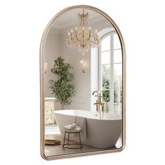 a bathroom with a bathtub and a chandelier hanging from it's side