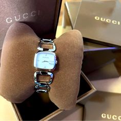 Brand New Gucci Women’s Watch In Silver. Comes With Case. Timeless Gucci Watch As Gift, Timeless Gucci Watch As A Gift, Silver Designer Watches, Gucci Timeless Rectangular Dial Watch, Gucci Timeless Watch With Rectangular Dial, Modern Gucci Watch For Gift, Gucci Analog Watch Gift, Gucci Analog Watch As Gift, Gucci Analog Watches As Gifts