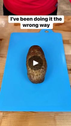 a piece of bread sitting on top of a blue cutting board