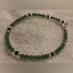 New Handmade Green Dyed Jade W/Black & Silver Accents Ankle Bracelet, Anklet, 9.25” Length Details & Features New, Handmade, High Fashion Costume Jewelry Approx. 9.25” Length Could Be Worn As A Bracelet Or As A Fun Addition To A Convertible Necklace. Strong But Flexible Acculon Triple-Strand Braided Stainless Steel Stringing Wire Sterling Silver-Plated Spring Ring Clasp & Jump Ring Closure & Accent Beads Sterling Silver Findings Dyed Green Jade (Natural Stone) Beads Black Glass Beads Miyuki Ster Ankle Bead Bracelets, Casual Black Handmade Anklets, Dark Green Bracelet, Convertible Necklace, Fancy Jewelry Necklace, Green Beaded Necklace, Black Bracelet, Natural Stone Beads, Craft Stuff