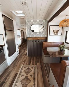 the interior of an rv with wood flooring