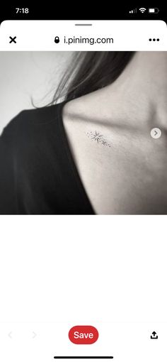 the back of a woman's chest with an arrow tattoo on her left side