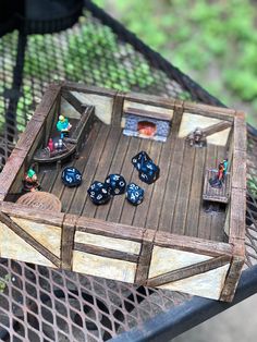 a wooden board game sitting on top of a metal table