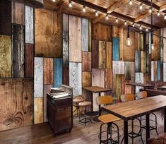 an image of a restaurant setting with wood paneling on the walls and wooden floors