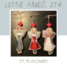 three little angel ornaments hanging from strings on a wooden table with text overlay that reads, little angels fifth