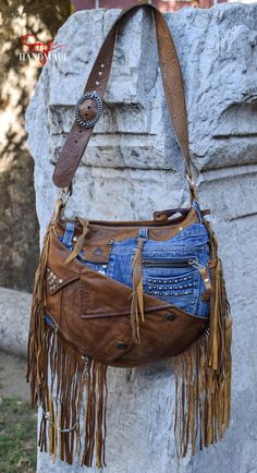 Model Name:  ----| "Light Brown Fringes" I have handcrafted this unique one of a kind shoulder bag with high-quality new & recycled selected materials. Every detail I did on the bag has a role in the whole design. Every stitch I made has a meaning. / Features: ----| Adjustable leather shoulder strap with buckle. ----| The inner lining is made of cotton-polyester with print + denim + leather. ----| Zip closure. ----| Inner pockets: 4; Outer pockets: 8. / Materials used: ----| 2 Types of first-rat Rock N Roll Cowgirl, Recycled Jeans Bag, Denim Shoulder Bag, Denim Shoulder Bags, Recycled Jeans, Print Denim, Rock N’roll, Leather Denim, Jeans Bag