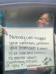 a woman holding up a sign that says nobody can trigger your emotion without your expression