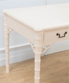 a white table with two drawers on it