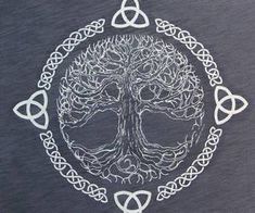 the tree of life is depicted in this t - shirt with celtic knots around it