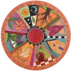 the wheel of life is painted with different colors and symbols, including birds, flowers, leaves, and trees