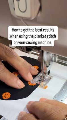 someone is using a sewing machine to sew on the fabric with their hands and fingers