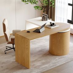 an office desk with a laptop on it in front of a window and a potted plant