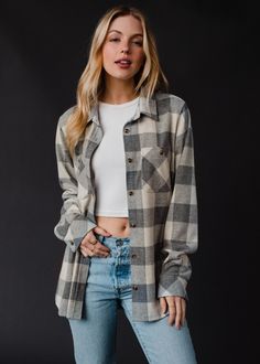 The softest flannel you'll ever own! Our new gray and cream super soft plaid flannel is a must have for your fall and winter wardrobe. Gray and cream super soft plaid flannel Long sleeves Button closure on the front Designed in the U.S.A. Produced in China. Model is wearing a size small  100% Cotton SIZE CHART S: Bust: 40" / Length: 24.5" M: Bust: 42" / Length: 25.5" L: Bust: 44" / Length: 26.5" XL: Bust: 46" / Length: 27.5" Blouses Vintage, Flannel Sweatshirt, Fall Flannel, Closet Goals, Flannel Women, Long Jumpsuits, Plain Shirts, Top Graphic Tees, Soft Flannel