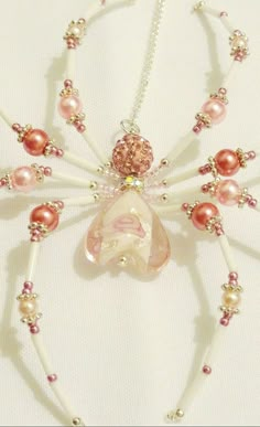 a beaded necklace with pink and white beads