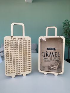 two wooden suitcases sitting on top of a table