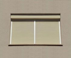 an open window on the side of a building with white blinds and no blindes