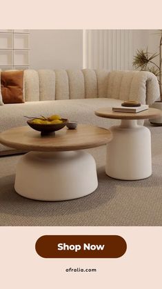 a living room filled with furniture and a bowl of fruit on top of the coffee table