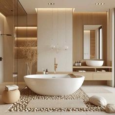 a large white bath tub sitting in a bathroom next to a sink and mirror on the wall