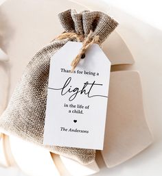 a tag that says thanks for being a light in the life of a child