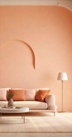 a living room with a couch, table and lamp on the floor in front of an orange wall