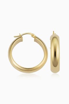 Radiant. Bold. Timeless. Our High Society Large Hoops are the statement earrings every fine jewelry collection needs. The wide, flattened solid gold tubes give them a classic, vintage feel, while the curved design creates a dome effect for maximum shine. Metal: 14 Karat Yellow Gold Dimensions: 6mm Width, 20mm Inner Diameter Construction: Solid Gold Tubing, Latch Closure Weight: 3 Grams Origin: Crafted in Arezzo, Italy Classic Polished Yellow Gold Earrings, Classic Yellow Gold Polished Earrings, Classic Polished Finish Yellow Gold Earrings, Classic Hallmarked Luxury Earrings, Classic Gold Plated Polished Hoop Earrings, Classic Gold Plated Hoop Earrings With Polished Finish, Classic Gold Earrings With Shiny Finish, Classic Earrings With Polished Finish, Classic Yellow Gold Earrings With Shiny Finish