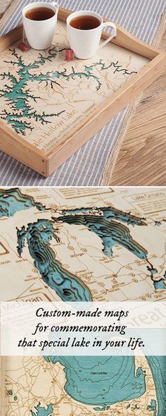 two cups of coffee sitting on top of a wooden tray next to a map with the words custom made maps