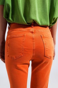 These orange jeans are endlessly chic, with their stretchy denim, bodycon fit, high waist, five functional pockets, frayed ends, belt loops, and zip fastening. The distressed design provides a tasteful touch of design flare. The stretch denim fabric is made from 98% Cotton and 2% Elastane. In our photos, we pair the shirt with our Striped Sleeveless Shirt in Blue. The model is 5’9” with measurements of 32-23-35 and is wearing a size small. The XS-S-M-L-XL sizing equates to US sizes of 2, 4, 4, 6 Minimalist Winter Wardrobe, Orange Jeans, Minimalist Winter, Types Of Jeans, Stretch Denim Fabric, Minimalist Dresses, Style Challenge, Online Fashion Boutique, Winter Tops