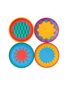 four paper plates with different designs on them