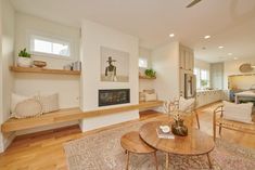 a living room filled with furniture and a fire place