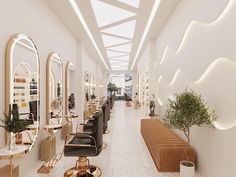 the interior of a hair salon with chairs, mirrors and potted plants in it