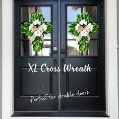 two wreaths on the front door of a house with words x2 crossweath perfect for double doors