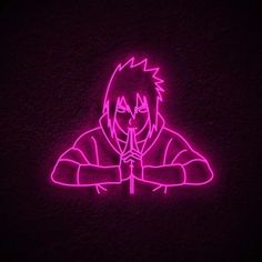 a neon drawing of a person sitting in front of a dark background