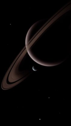 saturn and its rings in the dark sky