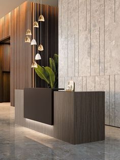 an office lobby with marble flooring and wooden wall paneling, along with a plant in the center