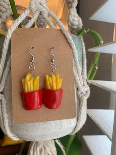 French Fries Dangling Earrings 🍟 Hand-crafted from Polymer Clay. Stainless steel hooks with plastic back stoppers.  Not safe for eating 😋 **Please note: Multiples of all earrings have been hand-made and therefore may look slightly different than pictured ** French Fries Earrings, French Fry, North Hollywood, Dangling Earrings, French Fries, Jewelry Earrings Dangle, Etsy Earrings, Dangle Drop Earrings, Polymer Clay