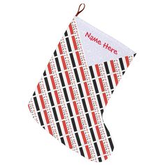 a red and black christmas stocking with the word name here on it's side