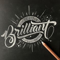 the word brilliant written in chalk on a blackboard with a pencil next to it