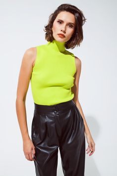 Brighten up your wardrobe with our Vibrant Lime Green Sleeveless Knit Top, a perfect blend of bold style and comfortable fit for your daily outfits. Eye-Catching Lime Green: This top's vivid lime green hue is sure to make a statement, adding a fresh and lively touch to your wardrobe. Sleek Turtleneck Design: The high turtleneck neckline adds a touch of elegance and sophistication, making it a versatile piece for various occasions. Comfortable Bodycon Fit: Crafted from a soft blend of 55% Viscose Neon Top Outfit, Lime Green Shirt Outfit, Lime Green Top Outfit, Top Without Sleeves, Green Shirt Outfits, Green Top Outfit, Warm Spring Outfits, Neon Green Top, Shiv Roy