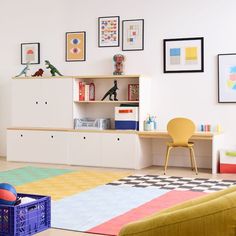 a child's playroom with toys and bookshelves