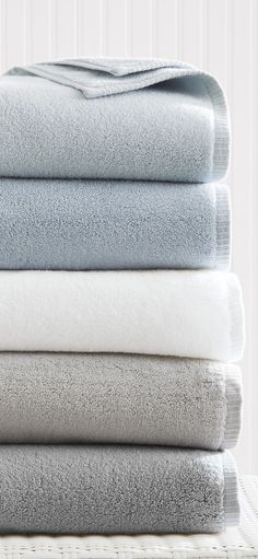 four folded towels stacked on top of each other