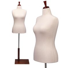 two white mannequins with wooden bases on display