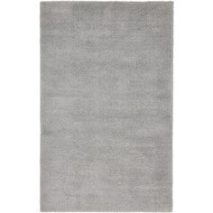 a gray rug on a white background with no one in the room to see it