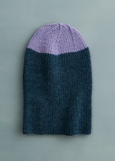 a knitted beanie sitting on top of a table