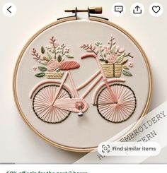 a pink bicycle with flowers on the front and back is featured in this embroidery pattern