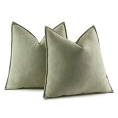 two green pillows on white background